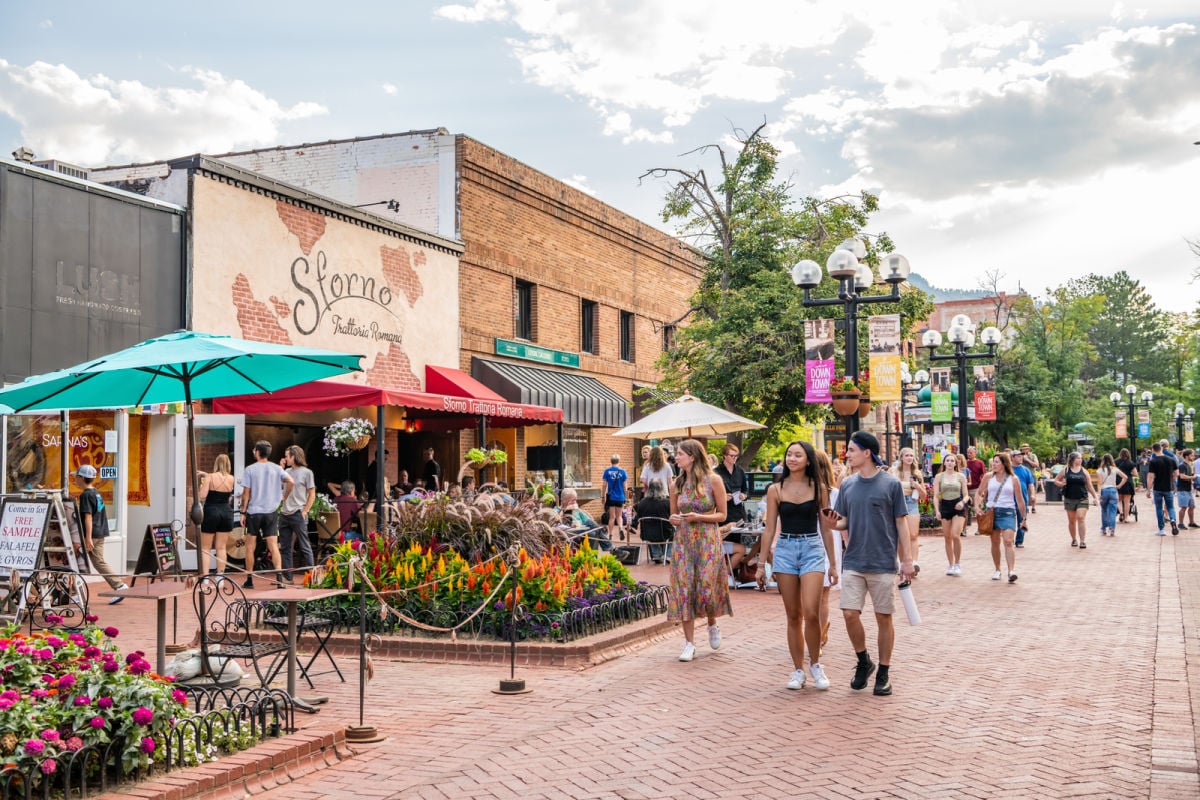 People walking through Boulder promenade